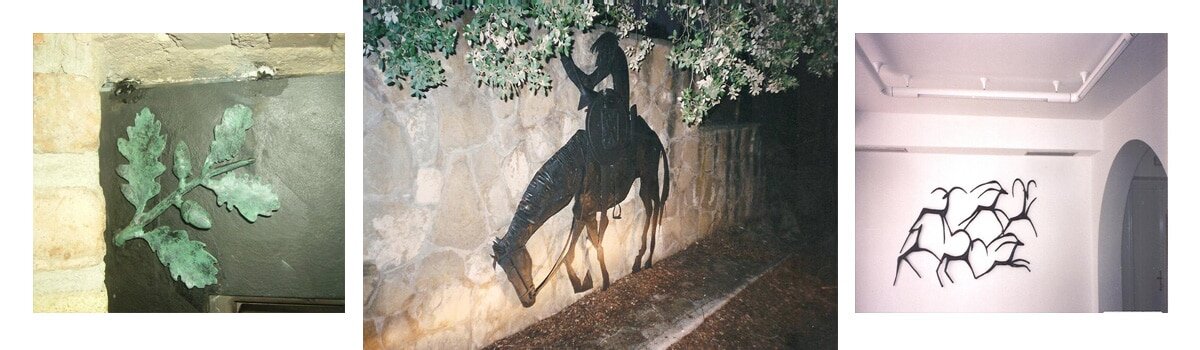 Figura de forja navarra sobre un muro.